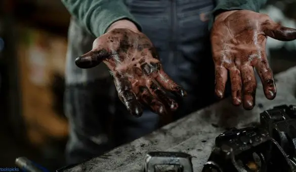 dirty man hands with engine oil